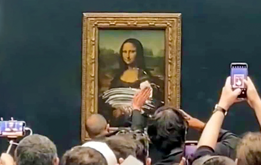 Mona Lisa Painting at Louvre Smeared With Cake Frosting